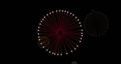 festive fireworks in a mesmerizing display against a dark sky, ideal for events or holiday promotions illustrating celebratory and festive themes. perfect for use in cards, invitations, or promotional materials related to new year's eve or other celebrations enhancing the sense of joy and brilliance.