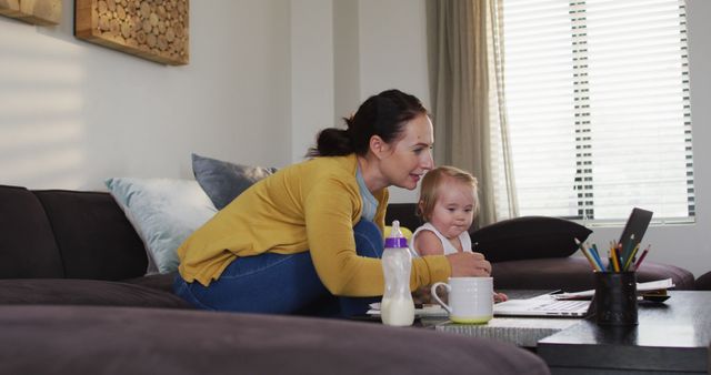 Mother Working from Home with Baby on Sofa - Download Free Stock Images Pikwizard.com