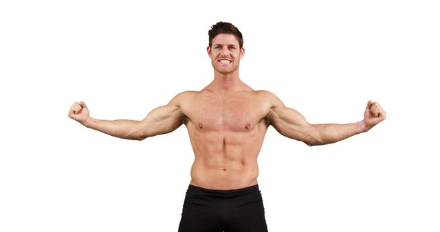 A young Caucasian male flexes his muscles confidently, with copy space. His strong physique and smile convey a sense of health and fitness.