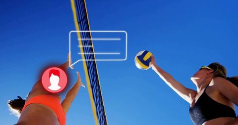 Women beach volleyball jumping to spike and block with chat overlay under blue sky