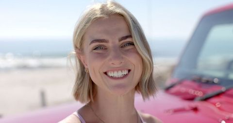 Smiling Young Woman Enjoying Surfside Road Trip