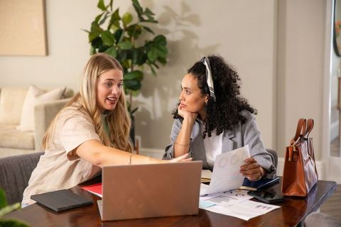 Diverse Coworkers Collaborating in Modern Home Office