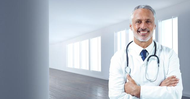 Doctor standing confidently in a bright, modern hallway, ideal for showcasing healthcare services, medical facilities, or healthcare professional profiles.
