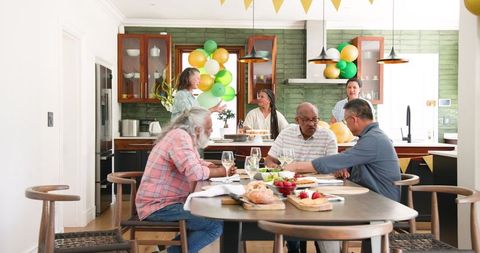 Senior Friends Celebrating with Lively Dinner Gathering