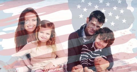 Caucasian Family Celebrating with American Flag Overlay on Beach