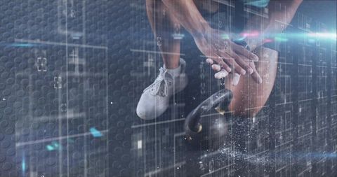 Athlete gripping kettlebell preparing for swing on gym mat with chalk dust