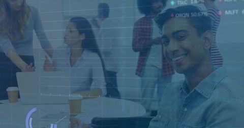 Diverse colleagues discussing with digital hud interface in workplace