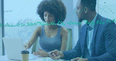 Diverse Professionals Collaborating on Laptop Project in Office