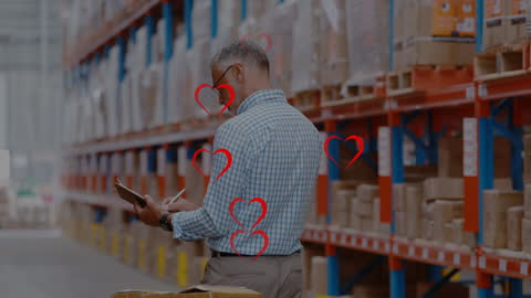 Warehouse Manager Reviewing Inventory on Tablet with Heart Icons