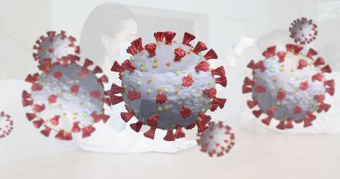 3d coronavirus particles overlaying clinic consultation with nurse scanning temperature