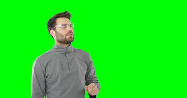 Man Wearing Protective Glasses and Gray Sweater on Green Chroma Key Background - Download Free Stock Images Pikwizard.com