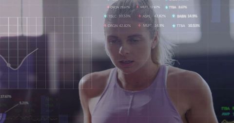 Female athlete pushing through workout with fitness HUD overlay and performance metrics