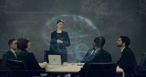 Presenting woman leading boardroom with holographic brain visualization for strategy