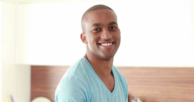 Smiling Young Man in Casual Light Blue Shirt - Download Free Stock Images Pikwizard.com