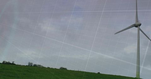 Wind Turbine Standing Over Green Hills with Grid Overlay Renewable Energy Concept