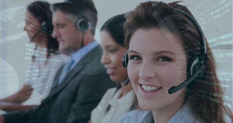 Diverse business team with data overlays in office environment