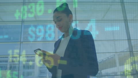 Businesswoman using smartphone with digital stock market data overlay