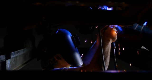 Welder Working in Dark Workshop, Sparking Light with Welding Torch - Download Free Stock Images Pikwizard.com