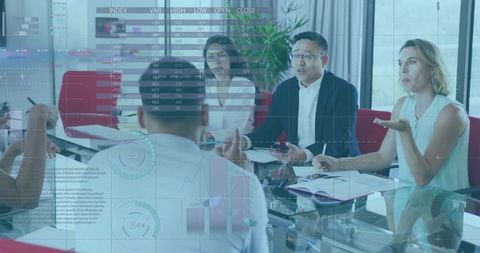 Executive presenting data to team around glass table with digital analytics overlay