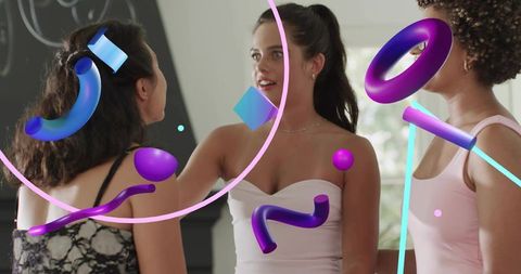 Young women chatting and gesturing with colorful 3D augmented reality overlays at home