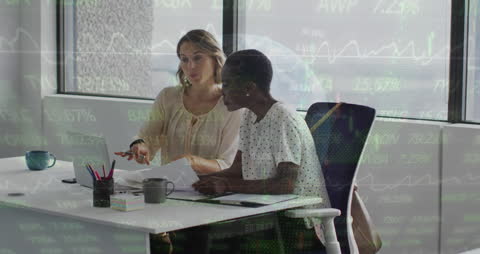 Colleagues Analyzing Financial Data in Office Environment