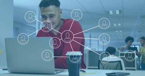 Connected Professional Working on Laptop in Modern Office