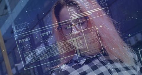 Data analyst interacting with holographic data panels in modern office