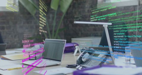 Digital code overlay on laptop in modern office