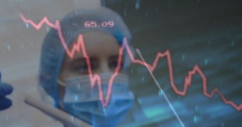 Healthcare Professional Analyzing Data with Medical Graph Overlay