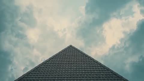 Clouds Passing Over Rustic Shingled Roof Aesthetic