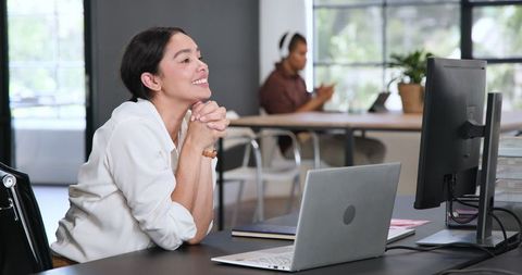 Smiling businesswoman excels in modern office environment