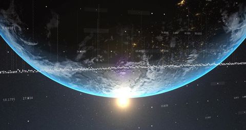 Earth rotating above sunrise horizon with satellite telemetry and digital data overlay