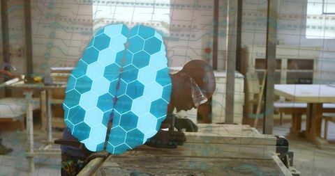 Mid adult carpenter marking timber with ruler in modern workshop with hexagonal tech overlay