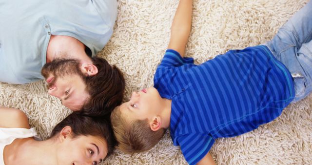 Family Enjoying Quality Time Relaxing on Carpet - Download Free Stock Images Pikwizard.com