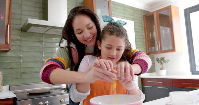 Mother and Daughter Cracking Egg Making Dough Together - Download Free Stock Images Pikwizard.com