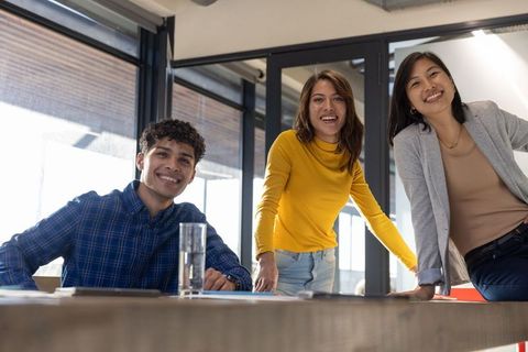 Diverse Team Collaborating Around Office Conference Table