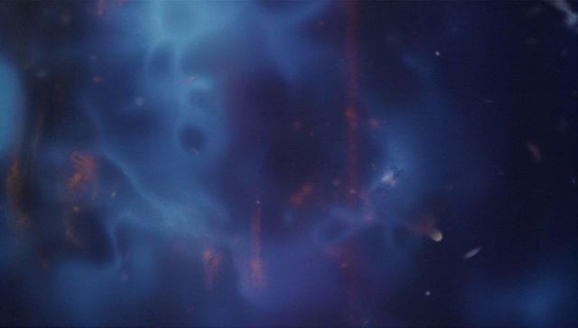 Ethereal cosmic nebula swirls with vibrant highlights