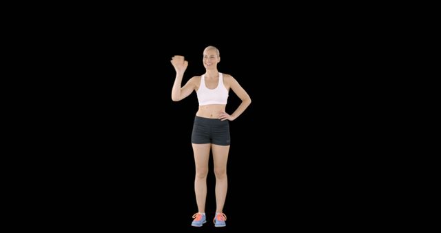Fitness Trainer Waving Hello in Sportswear on Black Background - Download Free Stock Images Pikwizard.com
