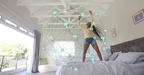 Happy Woman Embracing Futuristic Connection in Modern Bedroom