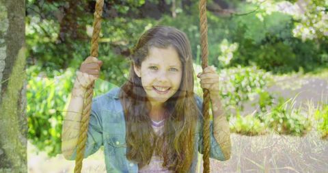 Joyful Girl Swinging on Sunny Day in Lush Garden - Download Free Stock Images Pikwizard.com