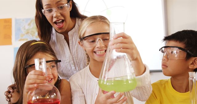 Children conducting science experiment with teacher in classroom - Download Free Stock Images Pikwizard.com