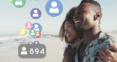 African American Couple Enjoying Beach with Social Media Engagement