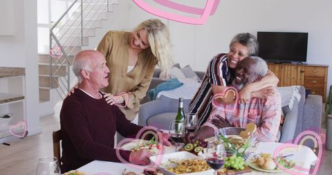 Senior Friends Enjoying Delectable Home Cooked Meal Together