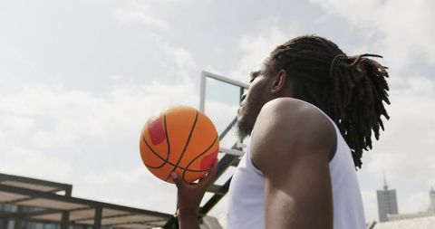 Determined Male Basketball Player Gazing Toward Hoop on Urban Court