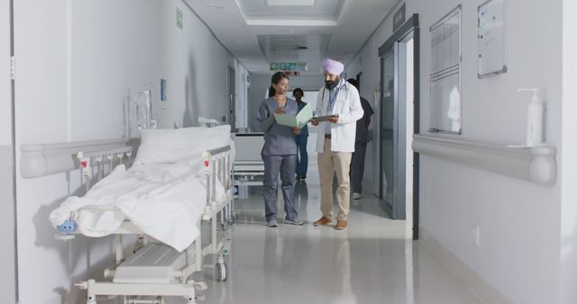 Medical Professionals Discussing in Hospital Hallway - Download Free Stock Images Pikwizard.com