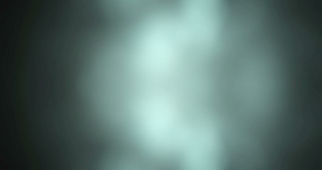 Abstract blurred light background featuring a teal glowing gradient, perfect for use in graphic design, web design, presentations, and as a backdrop for various creative projects. Its soft and hazy appearance lends a modern and subtle touch, ideal for adding a peaceful and serene element to visual content.