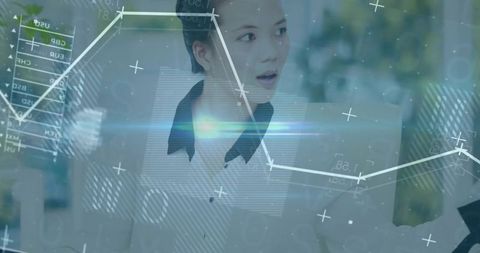 Asian Woman Engaged with Data Analytics in Modern Office Setting