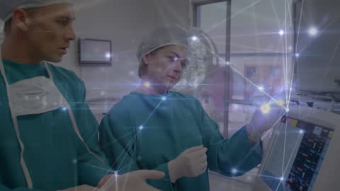 Surgeons Examining Medical Technologies with Digital Network Overlay