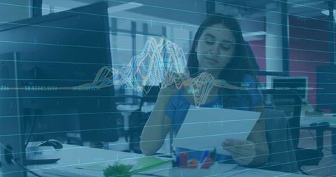 Woman reviewing financial report and annotating data with digital graph overlay