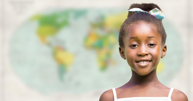 Smiling Young Girl Posing in Front of Blurred World Map - Download Free Stock Photos Pikwizard.com